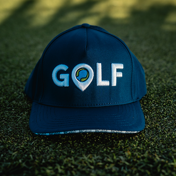 a golf cap with a beige plain background